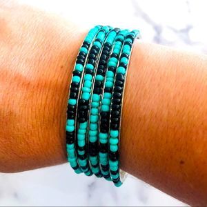 5 silver bangle bracelets with Teal/black beading